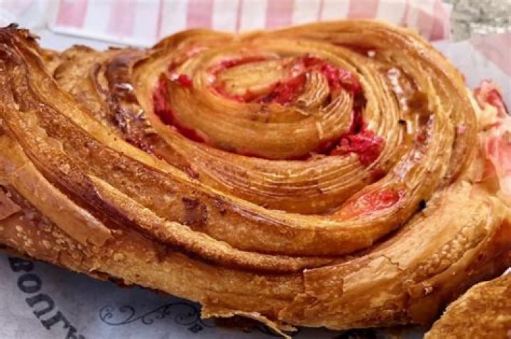 Sweet spiral pastry topped with icing Crossword Clue NYT